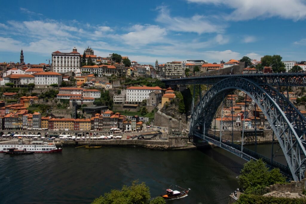 pexels-photo-2549572-2549572 Scenic view of Porto, Portugal featuring the iconic Dom Luís I Bridge over the Douro River.